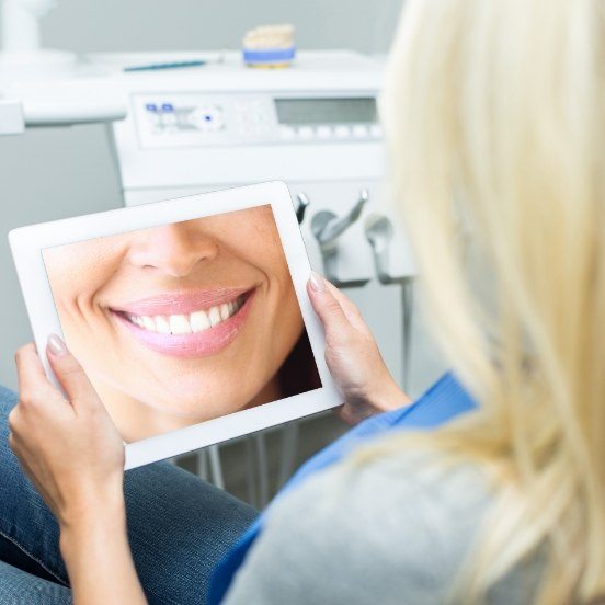 Woman looking at virtual smile design