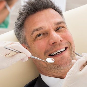 Man smiling at dentist