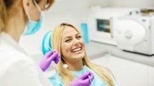 Woman laughing during preventive dentistry visit