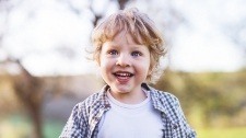 Chil with healthy smile after children's dentistry visit
